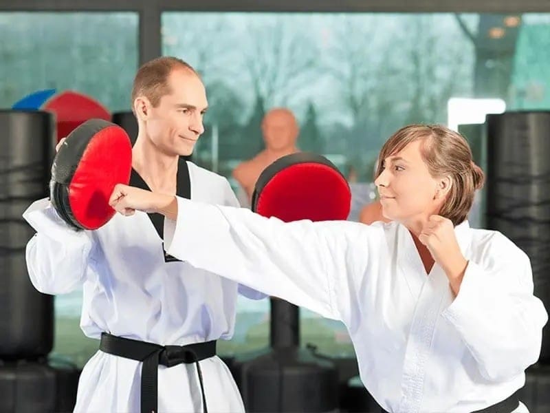 beginners learning martial arts basics with instructor guidance