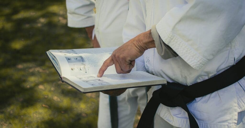 Black belt instructor teaching kenpo karate belt system concepts and quality instruction to students